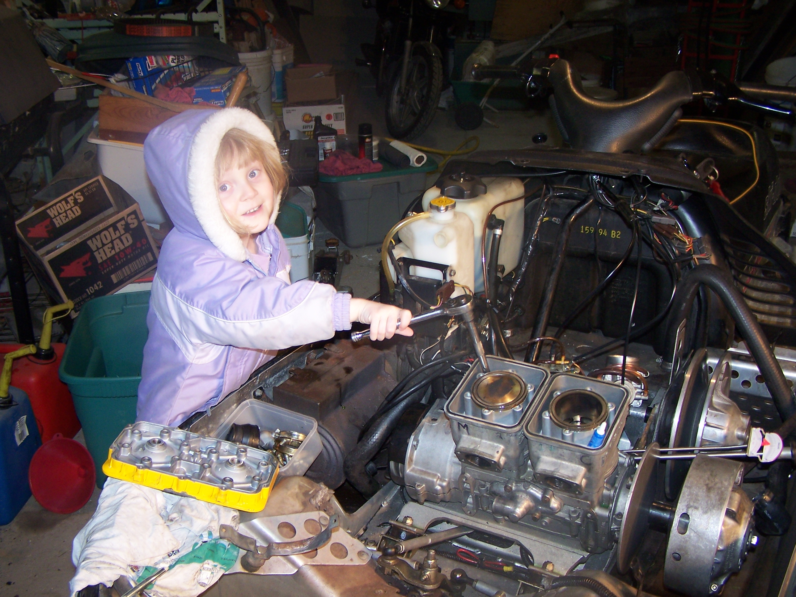 Heather helping assemble engine